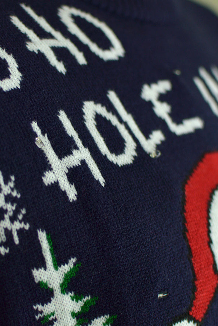 detail Pull de Noël pour Couple Lumineux LED Père Noël jouant au Golf